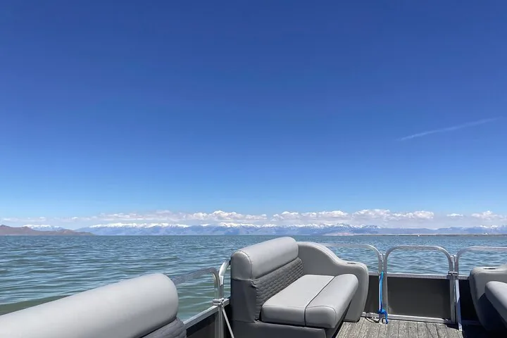 Boat view of Great Salt Lake, Utah, with snow-capped mountains in the distance.