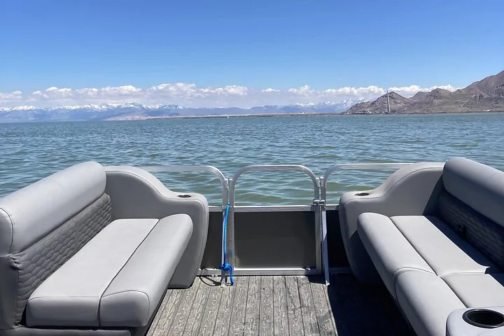 Looking out over Great Salt Lake from a pontoon boat towards the shoreline.